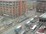 A Metrolink tram rolls into Piccadilly Gardens, in Manchester City Centre, from Piccadilly Station. From here it will either turn right for Bury or left for Altrincham or Eccles. View from nearby City Tower. [see image 29737] for an update.<br><br>[Mark Bartlett 25/02/2009]