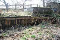 The timber loading bank at Humbie still exists despite the closure of the line in 1960. The line east from here to the terminus at Gifford was closed from 1948 following collapse of the Gilchriston Bridge. The bridge was immediately east of Humbie station. The line to Smeaton and Edinburgh ran off to the right.<br><br>[Ewan Crawford 21/03/2009]