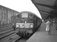 One of the 1200hp Co-Bo diesel locomotives, D5701, built by Metropolitan Vickers in 1958 as part of the <I>BR modernisation plan</I>, stands at Carlisle with a southbound train in the 1960s. Notoriously unreliable machines, of the 20 examples in the class, 19 had disappeared by December 1969 (8 to McWilliams, Shettleston and 11 to Cashmores, Great Bridge) with the remaining example now preserved on the East Lancs Railway [see image 18211]. <br><br>[K A Gray 30/07/1966]