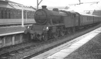 67662 with the 1.59pm train to Partick Hill waits in Springburn bay platform 3 in 1961. The NBL Hyde Park Works is in the background, with the Atlas Works behind the camera.<br><br>[K A Gray 03/07/1961]