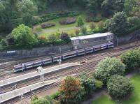 An Edinburgh-Glasgow shuttle leaves Edinburgh Waverley on 06 September 2003. Photographed from the top of the <i>Scott Monument</i><br><br>[James Young 06/09/2003]