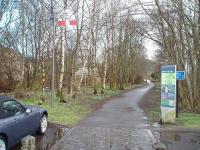 Looking south from the site of Aberfoyle station, now a car park, along the old trackbed towards Gartmore and beyond. This is now a footpath and cycleway, marked at the start by a replica semaphore signal, which unfortunately has had the signal arm mounted back to front. [See image 28487] for a 1958 view of the same location.<br><br>[Mark Bartlett 26/03/2009]