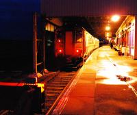 A sprinter passes some time whilst the lone passenger walks up and down the platform to stay warm.<br><br>[Ewan Crawford 18/10/2008]