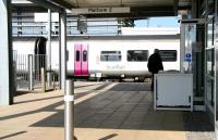 A splash of pink at Edinburgh Park on 2 April as an Alphaline liveried 158 calls on its way to Waverley.<br><br>[John Furnevel 02/04/2009]