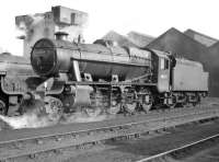 A powerful looking study of Stanier 8F 2-8-0 no 48399 off Leeds Holbeck shed standing at Kingmoor circa 1964, presumably having worked in on a freight over the Settle and Carlisle line. <br><br>[Robin Barbour Collection (Courtesy Bruce McCartney) //1964]