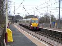 334 017 heads a 6-car train for Glasgow at Lochwinnoch on 1 April 2009.<br><br>[David Panton 01/04/2009]