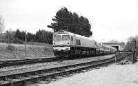 Transforming the face of UK freight. The first privately owned locomotive type to operate regularly over a UK main line, Foster Yeoman 59002 with a train of Mendip stone at Warminster in April 1986. The locomotive was photographed shortly after entering service following arrival from General Motors, USA. [See image 34587].<br><br>[Peter Todd 17/04/1986]