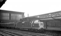 Deltic D9019, as yet unnamed, photographed passing through Carlisle on Saturday 25 April 1964. The locomotive is in charge of the late running 1A35 1000 Edinburgh - Kings Cross <I>Flying Scotsman</I> which has travelled via the Waverley route following a derailment on the ECML near Belford. The Deltic is sporting the <I>Winged Thistle</I> headboard introduced on these services earlier that year. [With thanks to Paul Bettany for additional information]<br>
<br><br>[K A Gray //1965]