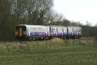In order to cope with increased volumes of traffic on 4 April 2009, Grand National day, the Northern trains Preston to Ormskirk shuttle operated using a 153+150 combination. The photograph shows 153331 on the Preston end of the 1710 hrs Preston to Ormskirk service with 150224 leading as the service passes Ulnes Walton between Midge Hall and Croston. The area on the other side of the tracks was a WW2 ammuntion storage site with protected storage bunkers (some still exist) which were interconnected by railway sidings linking onto the Preston - Ormskirk line. Some of the site is now occupied by HMP Garth and HMP Wymott.<br><br>[John McIntyre 04/04/2009]