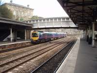 In addition to the platform tracks, one of the two through roads at Dewsbury was reinstated to cope with increased traffic. It allows fast trains heading for Leeds to overtake slower services and is well used. Transpennine Express unit 185134 leaves for Leeds and Middlesbrough in a view taken from just outside Dewsbury's increasingly popular station buffet bar, the start of a <I>Rail Ale Trail</I> through Huddersfield to Stalybridge. [See image 31409] for the same view in 1986.<br><br>[Mark Bartlett 04/04/2009]