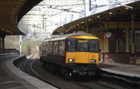 318 257 with a Glasgow-bound service stands at platform 3 of Gilmour Street station, Paisley on 1 April 2009.<br><br>[David Panton 01/04/2009]