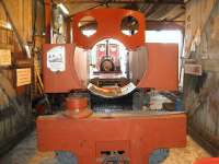 There's something missing! Kerr Stuart <I>Joffre</I> 0-6-0T+WT sits in the shed at Becconsall on the West Lancashire Light Railway. The locomotive was one of 70 built for the French Government Artillery Railways during World War 1. It had been in use in a quarry near Calais from after the war and was repatriated to the UK in 1974 in a derelict state. Initially it was stored, but restoration has now been underway for a number of years. Seen through the gap between the two side tanks where the boiler and smokebox should be is Quarry Hunslet <I>Irish Mail</I> resting between turns on the <I>Friendly Engines Day</I> service on 05 April 2009. [See image 36154]<br>
<br><br>[John McIntyre 05/04/2009]