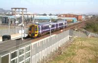 Eastbound 158 leaves Edinburgh Park heading for Haymarket on 2 April, seen through the glass of the station overbridge. <br><br>[John Furnevel 02/04/2009]