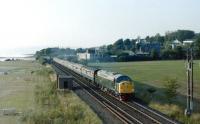 An EE Type 4 leaving Largs with a special, near <i>The Pencil</i> in the summer of 1984. The train in question is thought to be the 1Z36 Largs - Macclesfield and the date 19 August.<br><br>[Colin Miller 19/08/1984]