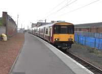 318 257 stands at Ardrossan Town on 1 April 2009, about to start the return journey to Glasgow Central.<br><br>[David Panton 01/04/2009]