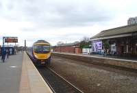 Transpennine unit 185141 is heading for Liverpool at Stalybridge, which will mean a left turn for Guide Bridge and Piccadilly just beyond the platform. Trains for Ashton-under-Lyne and Manchester Victoria continue straight on. On the opposite platform is the famous Stalybridge station buffet, at the end of the <I>Rail Ale Trail</I> from Dewsbury.<br><br>[Mark Bartlett 04/04/2009]