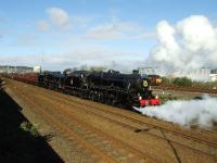 45407 and 45231 reverse the ECS of <I>Great Britain II</I> into Inverness Station. 45407 has a floral wreath on the smokebox, presumably for Easter Sunday. 67011 can't compete and sits in the huff in the background.<br><br>[John Gray 12/04/2009]