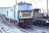 D7034, in early blue with white window surrounds and small warning panel, heads a line up of three stored Class 35 Hymeks and a Warship [See image 31029] at Old Oak Common Depot. Withdrawn in January 1972, D7034 had been cut up at Swindon by September the same year.<br><br>[Mark Bartlett //1972]