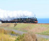 Black 5 45407 pilots stablemate 45231 climbing hard on the cliffs above the North Sea at Doonies, just south of Aberdeen, with the <I>Great Britain II</I> on a glorious Easter Sunday 12 April 2009.<br><br>[Brian Taylor 12/04/2009]