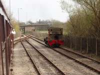 Andrew Barclay 0-4-0ST <I>John Howe</I> runs round its three coach train in the RSR exchange sidings. On weekdays these sidings are used by EWS (DBS) to bring in loaded bitumen tanks and take out the empties for Lindsey. This view from the train looks towards Strand Rd crossing where the Network Rail metals start.<br><br>[Mark Bartlett 13/04/2009]