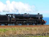 Stanier Black 5 no 45407 <I>Lancashire Fusilier</I>, high on the cliffs south of Aberdeen on 12 April 2009 at the head of the <I>Great Britain II</I> railtour.<br><br>[Brian Taylor 12/04/2009]