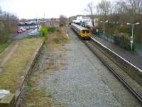 Merseyrail EMU 507011 waits at Ormskirk before returning to Liverpool Central on 30 March 2009. Ormskirk station building on the old Up platform (now the only one in use) is undergoing extensive refurbishment at present and basic temporary facilities are currently in place.<br>
<br><br>[John McIntyre 30/03/2009]