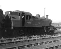 Withdrawn Ivatt class 2MT 2-6-2T no 41313 stands on one of the scrap roads at Barry on 7 August 1966. Built at Crewe in 1952 the locomotive spent its entire life operating in southern territory before being finally withdrawn from 70D Eastleigh in October 1965.<br><br>[David Pesterfield 07/08/1966]