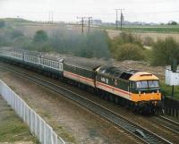 47637 <I>Springburn</I> (now WCRC 47826) on a special passing Goose Hill, Normanton, with the former Midland Leeds to Sheffield via Cudworth trackbed beyond.<br><br>[David Pesterfield //]
