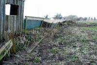 Saltoun goods loading bank looking towards the former eastbound platform and level crossing. The platforms here were staggered and there was a loop. The westbound platform was immediately to the right here but all traces have disappeared. Whisky from Glenkinchie was loaded onto trains at this loading bank.<br><br>[Ewan Crawford 21/03/2009]