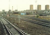 The north end of Cowlairs Carriage Sidings looking north, the cleaning sheds were behind the camera on the right. On the far right is the line to Springburn and at this date the Cowlairs Chord had not yet been built. Photograph taken from a northbound West Highland train in 1988. The sidings are long gone but the site remains in railway use.<br><br>[Ewan Crawford 03/09/1988]