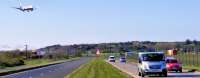 Planes, Trains and Automobiles......<br>
View North of Prestwick International Airport station (where the station nameboards read <I>Glasgow Prestwick Airport</I>) with an approaching 334 on the left and a Ryanair Jet passing overhead.<br><br>[Colin Harkins 18/04/2009]