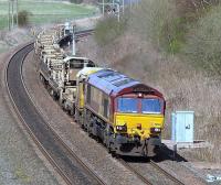 EWS 66124 heading south at Plean on 5 April with empty rail waggons.<br><br>[Brian Forbes 05/04/2009]