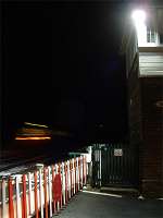 A sprinter heads west from the level crossing at Low Row.<br><br>[Ewan Crawford 27/02/2004]