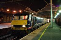 The northbound <I>Highland Sleeper</I> pauses at Preston platform 4 on 21 April 2009 with First ScotRail liveried 90024 at the helm. The departure from Preston is scheduled for 0052 hrs and the train contains through carriages for Aberdeen, Fort William and Inverness.<br><br>[John McIntyre 21/04/2009]