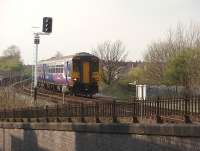 156471, entering Preston from Blackpool with an Easter Monday evening train, crosses over Maudland Viaduct and approaches Fylde Junction in April 2009. This view was taken from the steeply graded St. Marks Rd in Preston looking towards Blackpool. [See image 19669] for a similar view in 1981.<br><br>[Mark Bartlett 13/04/2009]