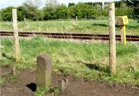 Adjacent to milepost 23 1/4 on the Preston to Ormskirk line just north of Midge Hall stands a Lancashire & Yorkshire Railway boundary stone. The remains of the original fence post can be seen to the right now that the new boundary fence is a few feet inside the actual boundary.<br><br>[John McIntyre 25/04/2009]