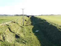 Old railway cutting with evidence of a retaining wall, near Gilmourton, between the former stations of Ryeland and Drumclog, South Lanarkshire. Seen in April 2009, some 58 years after the line was closed completely. <br><br>[Ken Browne 21/04/2009]