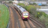 Edinburgh bound 170 470 passes the disused Burntisland East Junction on 18 April 2009. The junction once provided access to Burntisland docks and locomotive shed, as well as the pier originally used by train ferries to and from Granton prior to the opening of The Forth Bridge in 1890. <br>
<br><br>[David Panton 18/04/2009]