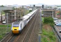 The 0755 National Express East Coast Inverness - London Kings Cross <I>'Highland Chieftain'</I> runs east through Edinburgh Park on 30 April, two minutes ahead of its scheduled arrival time of 1108 at Haymarket. The train has just passed between the under - construction bridge supports that will eventually carry the tram route to Edinburgh Airport over the line.<br>
<br><br>[John Furnevel 30/04/2009]