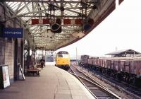 A down passenger train enters Carstairs in July 1969 headed by one of the <I>new</I> EE Type 4 locomotives built at the Vulcan Foundry during 1967/68.<br>
<br><br>[Colin Miller /07/1969]