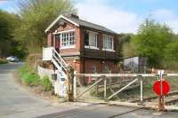 Signal box at Kirkham Abbey (closed to passengers 1930) on the York-Scarborough line on 19 April 2009, view north over the level crossing.<br><br>[John Furnevel 19/04/2009]