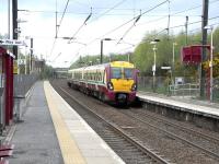 334 011 makes the hourly stop at Howwood on the Ardrossan Town to Glasgow service on 29 April and picks up the passenger.<br><br>[David Panton 29/04/2009]