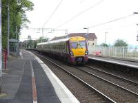 334 017 pulls into Woodhall with a Gourock to Glasgow stopper on 29 April 2009.<br><br>[David Panton 29/04/2009]