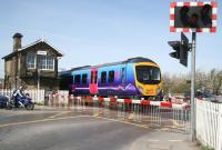 The 1047 Scarborough - Liverpool Lime Street TransPennine service runs west over Castlegate level crossing towards its stop at Malton on 22 April 2009.<br><br>[John Furnevel 22/04/2009]