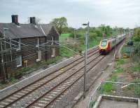 Of the four Lancaster and Preston stations that closed in 1939 only Barton and Broughton survived for a long period, with the station buildings used as private residences.  A 4-car Voyager speeds south towards Preston on the 70th anniversary of the station's closure. Sadly the building was demolished in 2013. <br><br>[Mark Bartlett 01/05/2009]