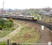 The Sunday morning 0908 Leeds - Glasgow Central CrossCountry service accelerates away from the stop at York on 19 April 2009. Most of the railway land in the background is earmarked for the massive York Central <I>'Teardrop'</I> development (so called because of the shape of the site) which will comprise over 86 acres of housing, offices and retail units and on which work is scheduled to start in the near future. <br>
<br><br>[John Furnevel 19/04/2009]