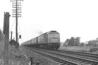 A Brush type 4 takes a train south on the ECML from Edinburgh circa late 1970s near St Germains level crossing.<br><br>[Bruce McCartney //]