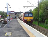 320 306 at Hyndland with a Balloch service on 2 May 2009.<br><br>[David Panton 02/05/2009]