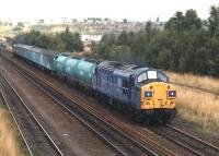 37023 on a weed killing train in the 1990s south of Calder Bridge Junction by the former 56A Wakefield shed north end exit.<br><br>[David Pesterfield //]