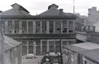 The old St Enoch locomotive shed looking across the triangle from a passing railtour in May 1967. Part of the station, closed the previous June, can be seen in the right background. The shed itself had been <I>'officially closed'</I> in 1935.<br><br>[Colin Miller /05/1967]